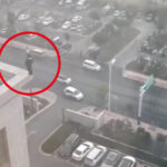 飛び降り自殺を図る中国人男性